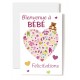 Carte Double Naissance Cœur composé d'accessoires de bébé sur fond rose